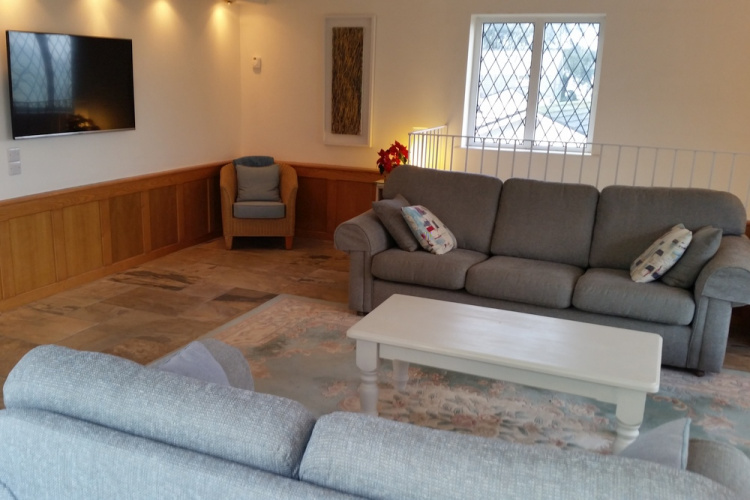 Sitting room leads out onto a veranda with far reaching sea views